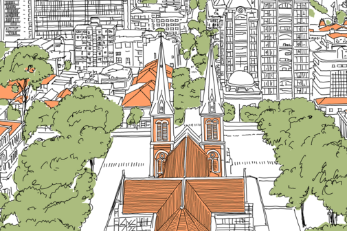 Eine Stadt, im Vordergrund eine Kirche , herum Gr&uuml;nanlagen und H&auml;user mit roten D&auml;chern. Im Hintergrund Hochh&auml;user